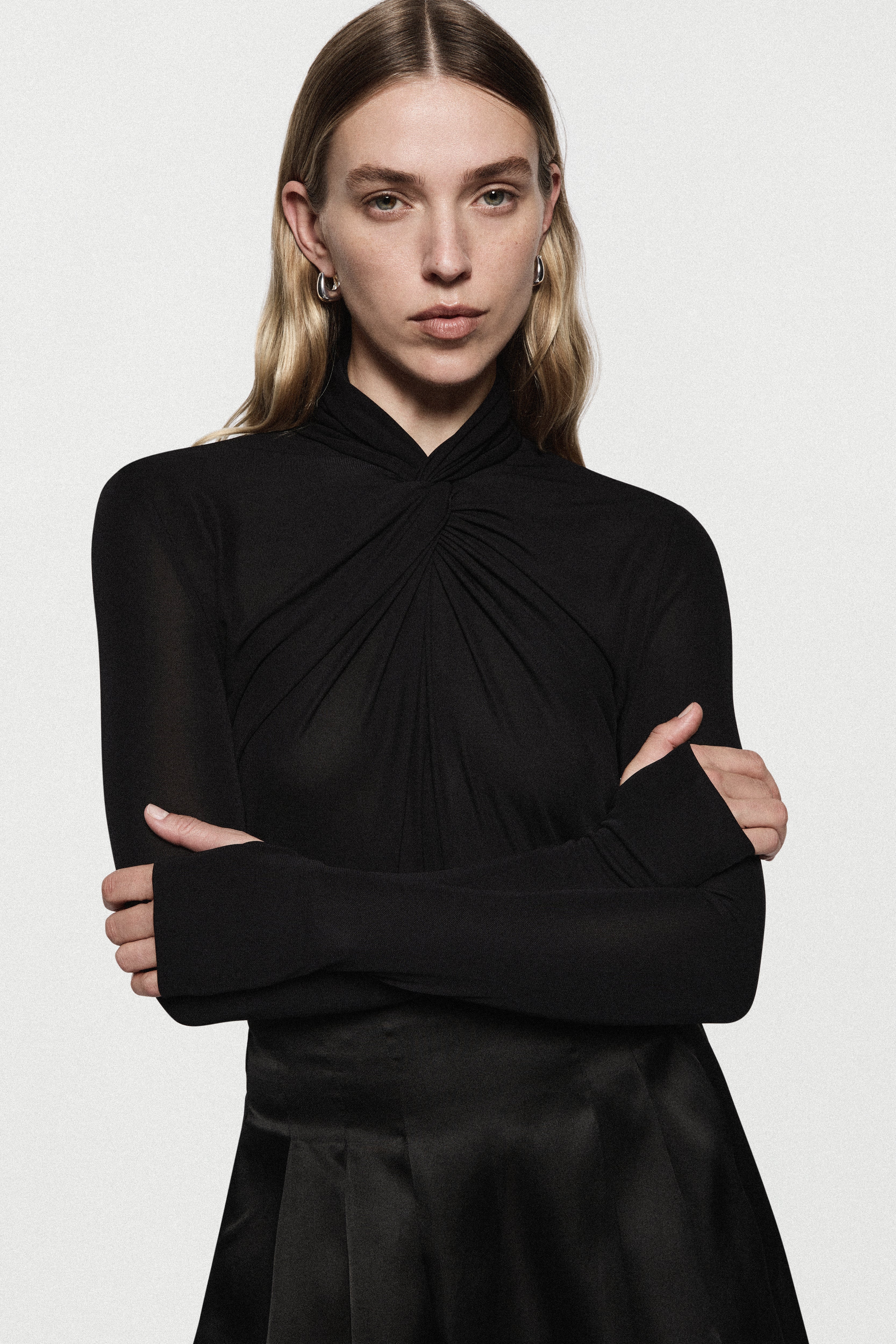 Black long-sleeve twist jersey top with ruched high neckline