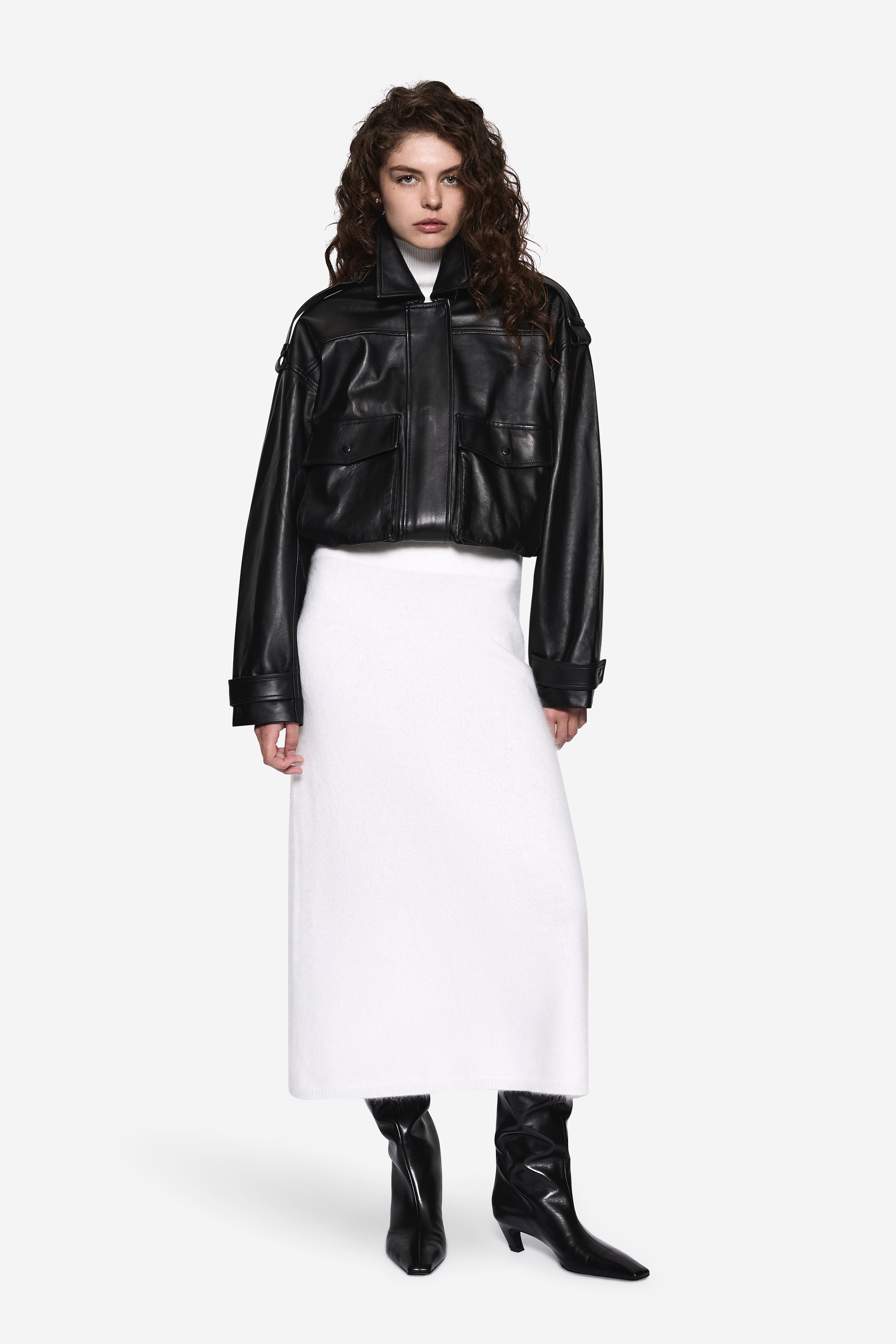 Black balloon leather jacket with zip front, stand collar, and flap pockets