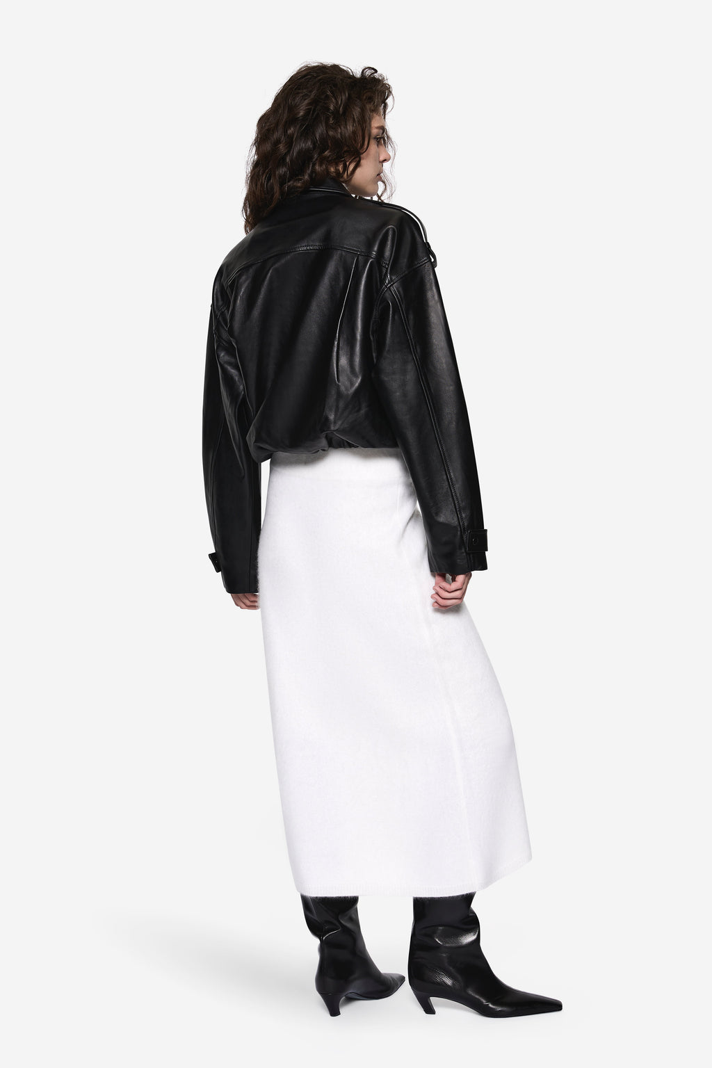 Black balloon leather jacket back view with stand collar and gathered sleeves