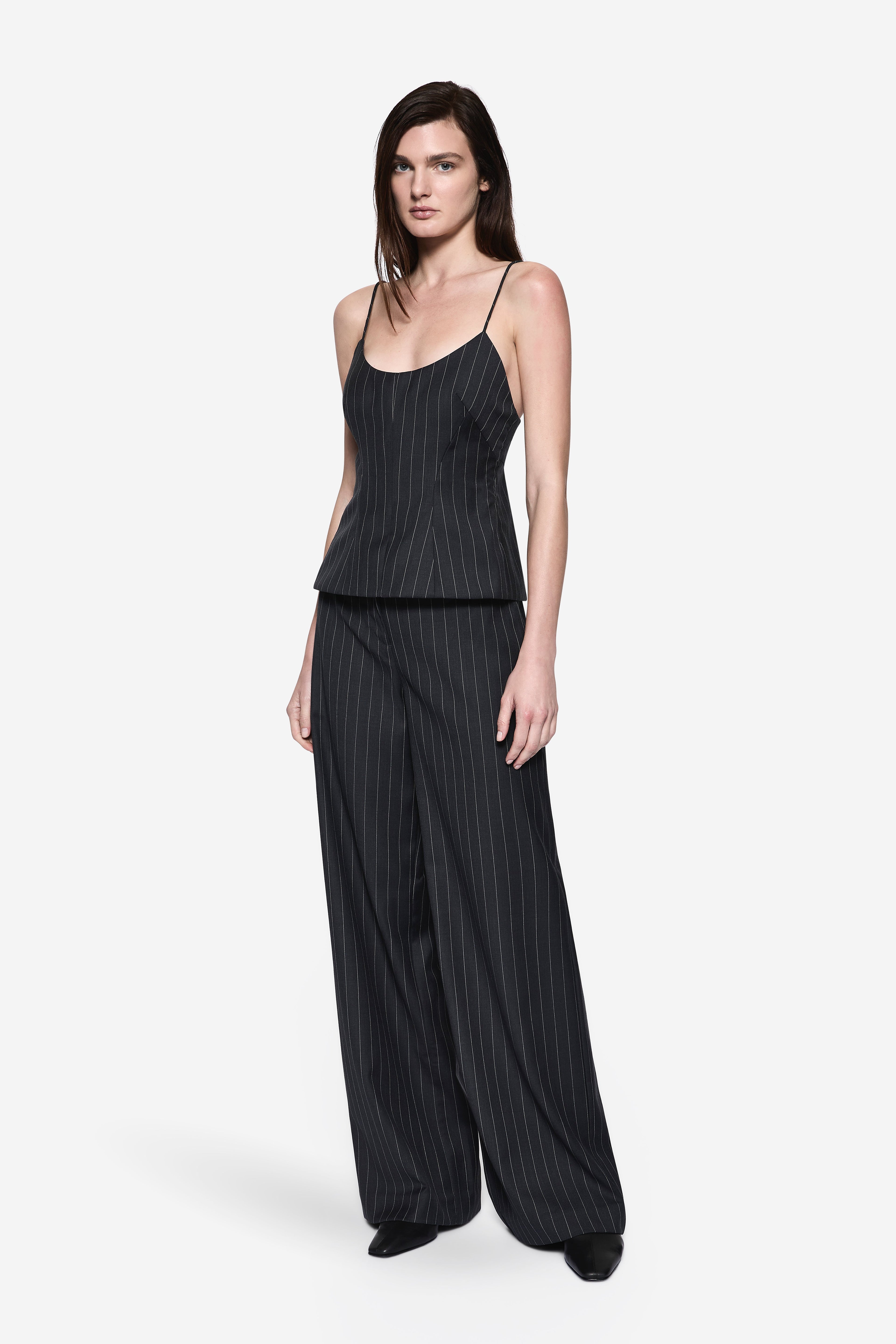 Front view of charcoal wool tailored pinstripe pants with relaxed wide legs