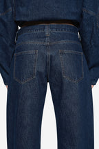 Vintage blue denim jeans back with yoke seam and two rear patch pockets