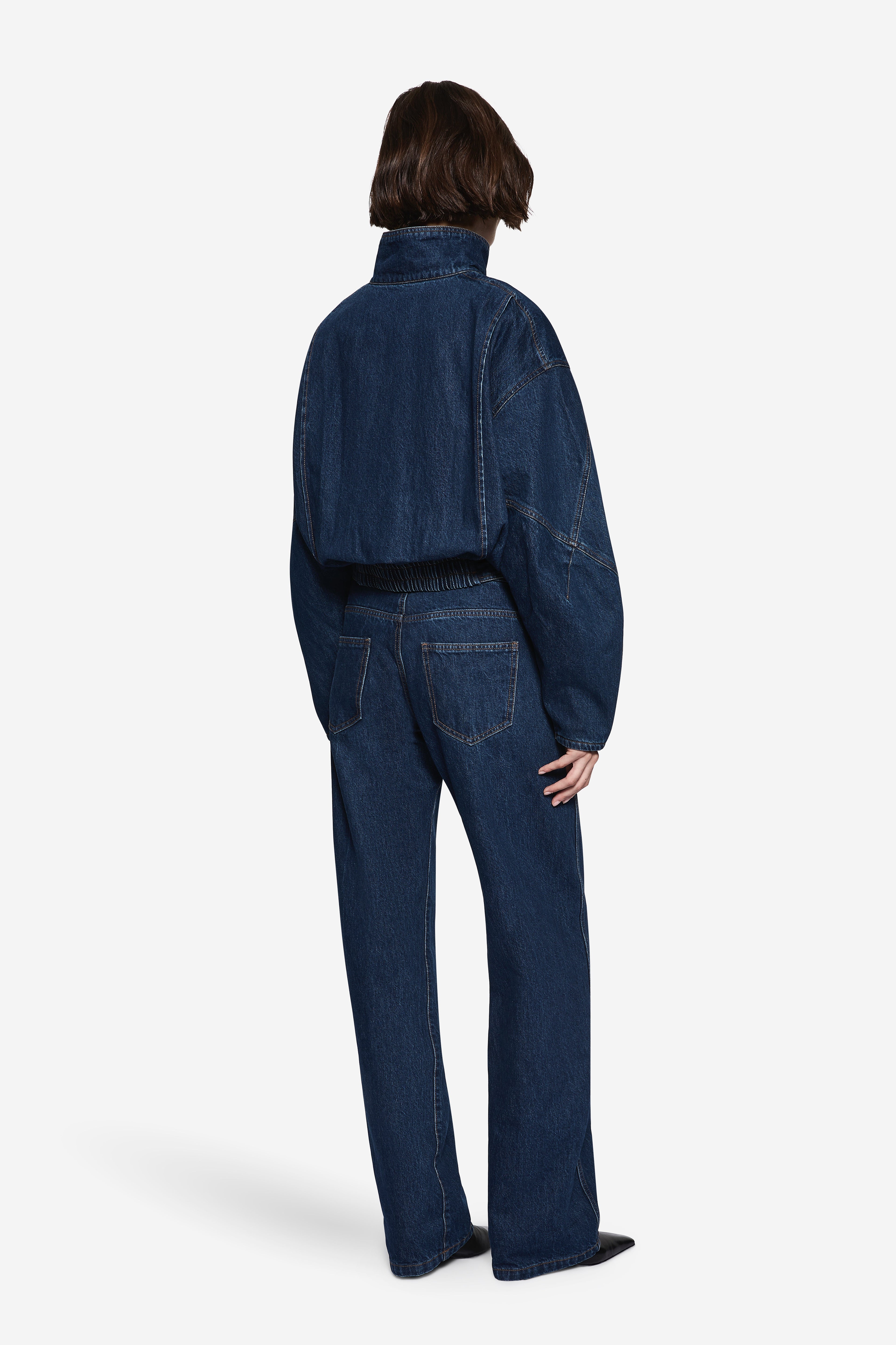 Vintage blue back-view wide-leg denim jeans with rear pockets and belt loops