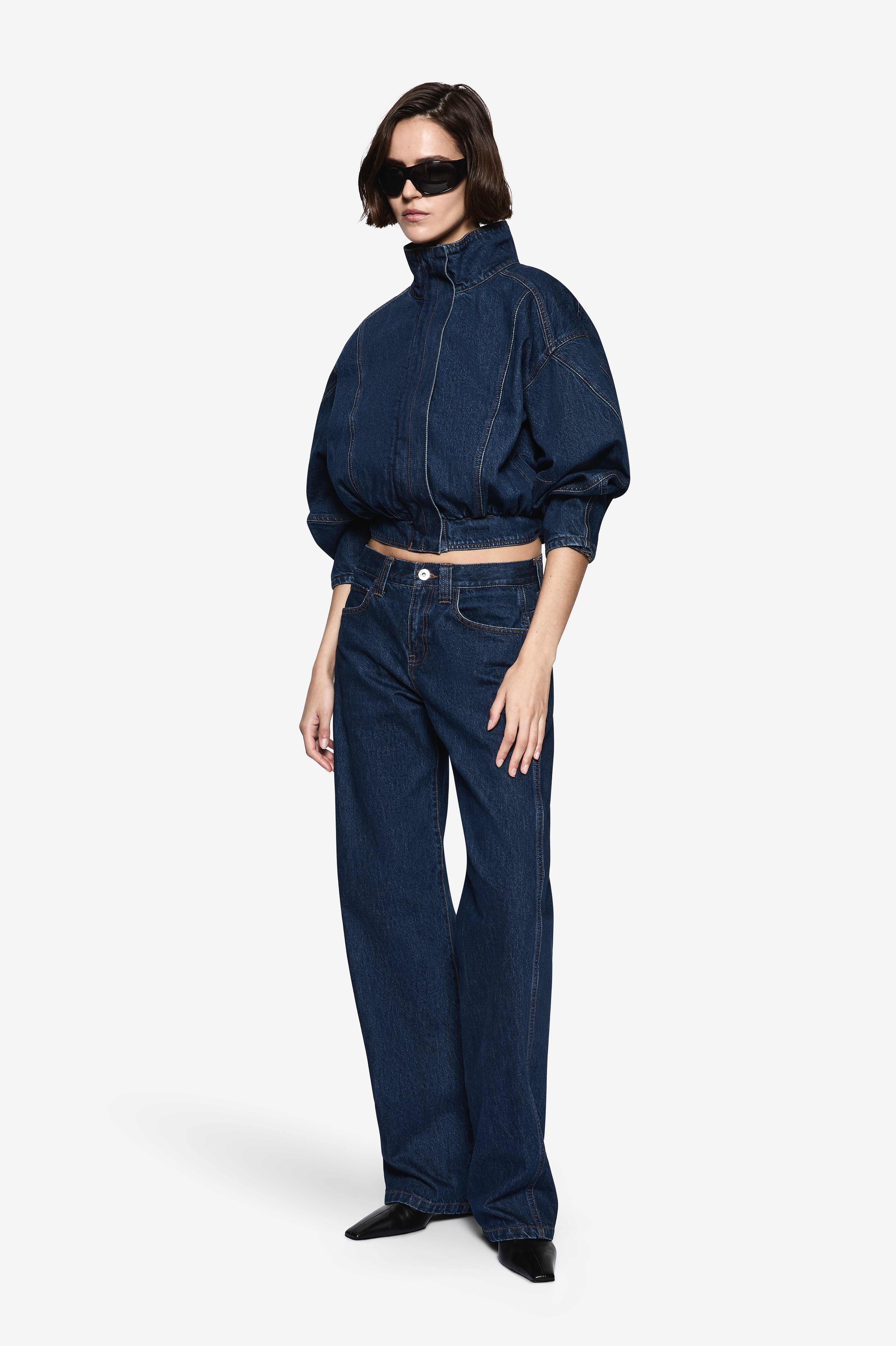 Vintage blue wide-leg denim jeans with zip fly and belt loops
