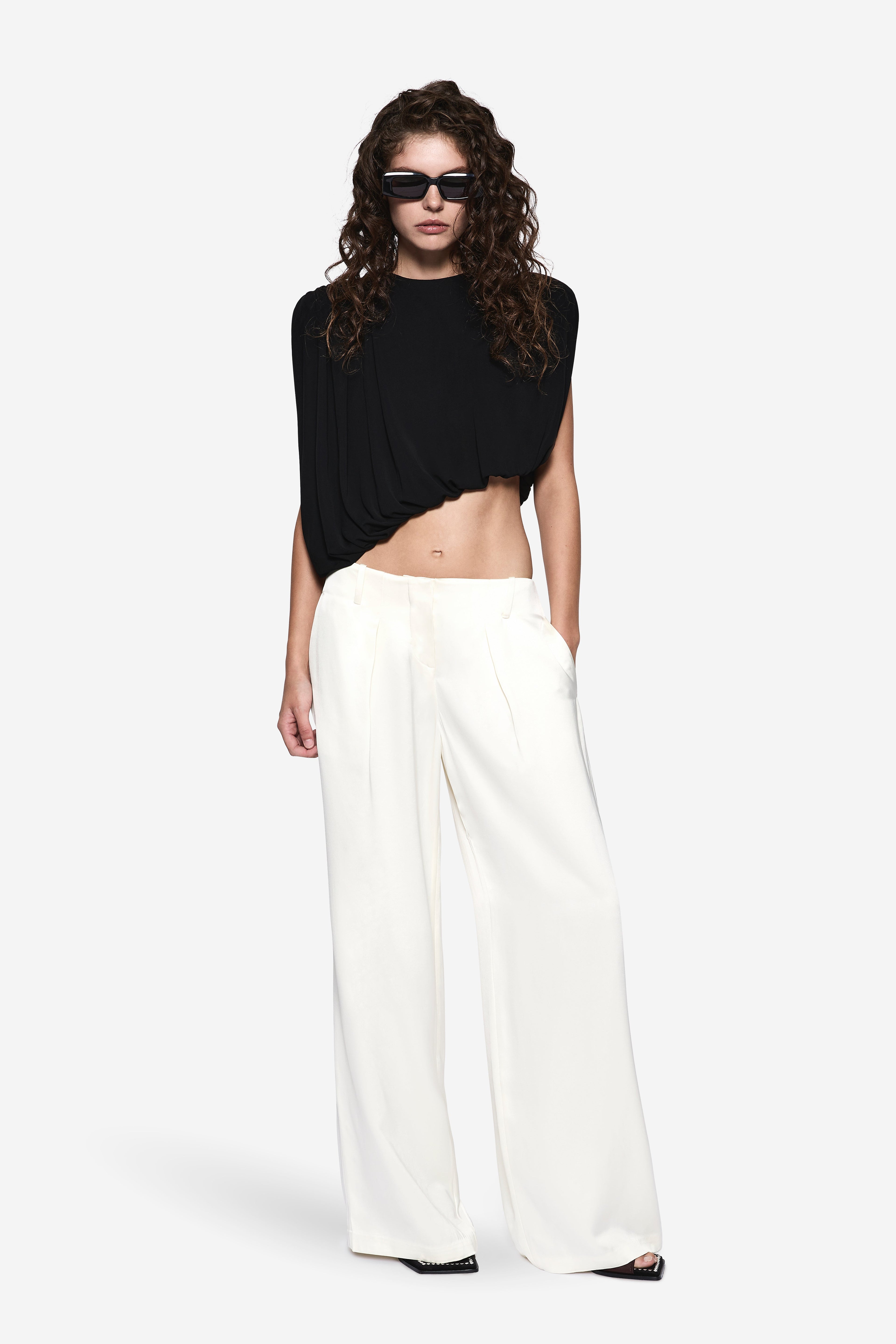 Off-white high-waist wide-leg acetate pants with pressed front creases