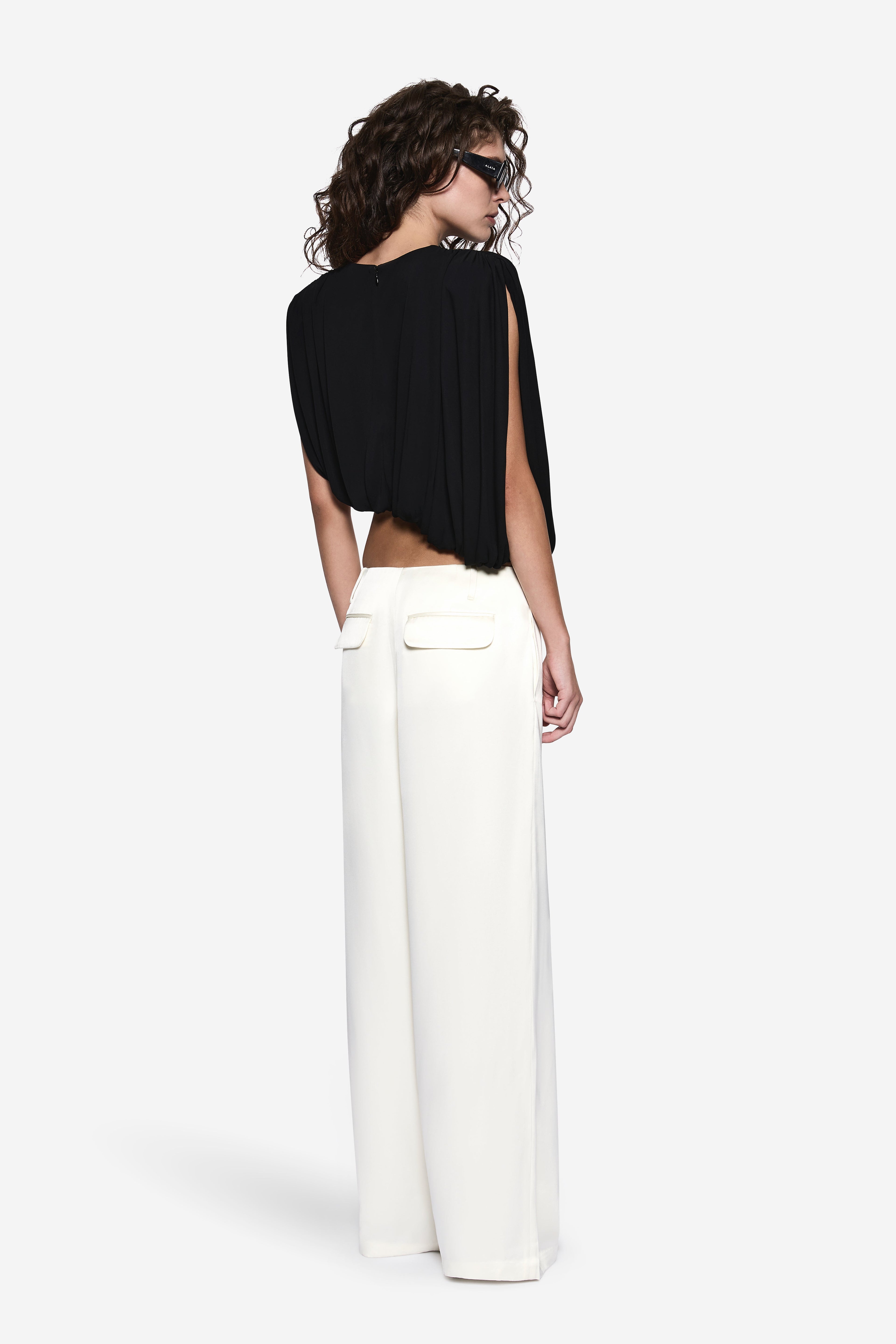 Off-white high-waist wide-leg acetate pants, back view with center seams