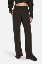 Merino knit pants close-up: dark hunter green elastic waistband and drawstring