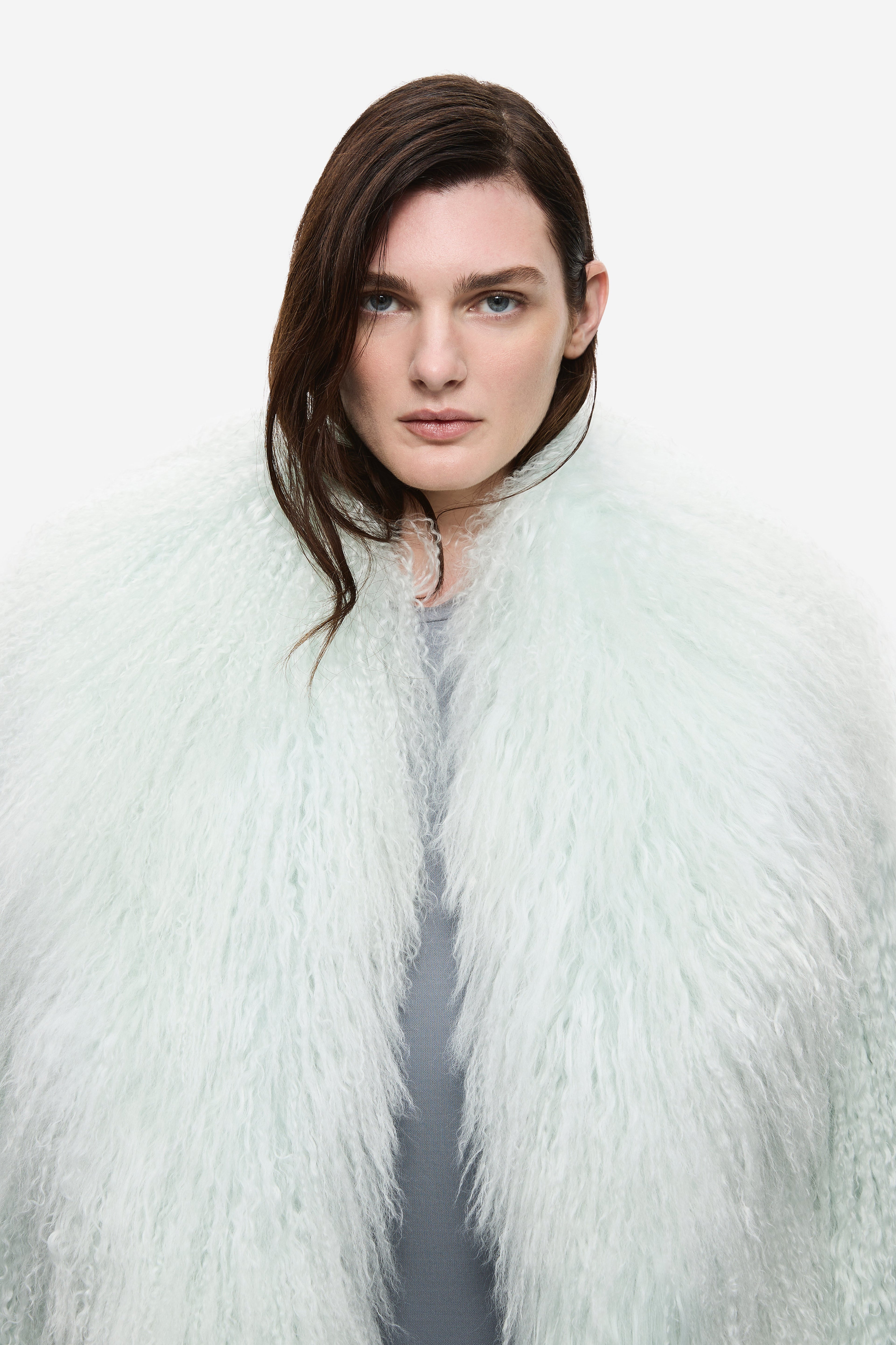 Pale mint shearling jacket with stand collar, open front, plush fluffy texture detail
