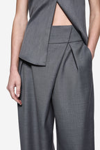 Grey wrap-front suiting pants with pleated drape and wide leg