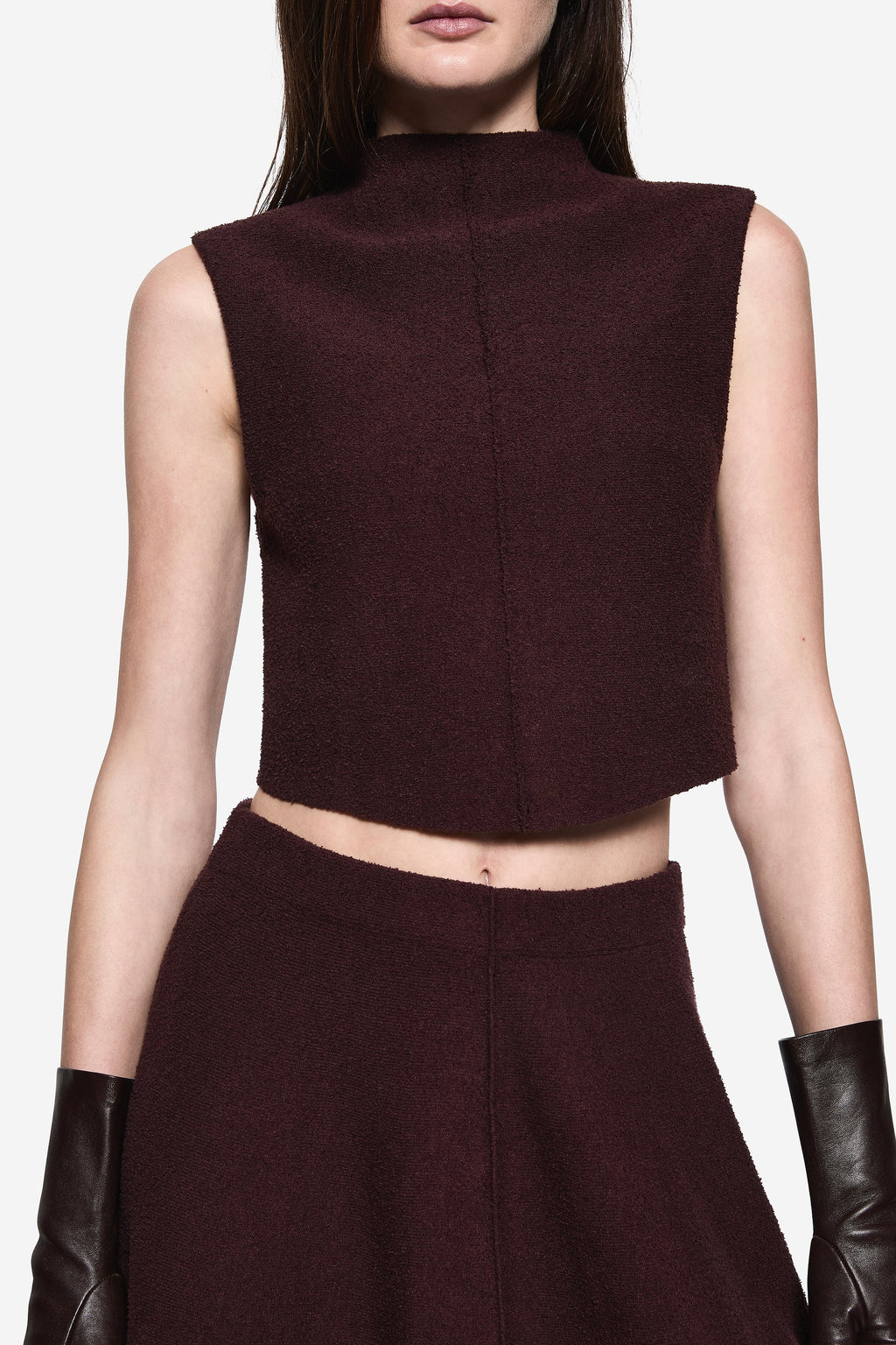 Burgundy boucle sleeveless high-neck crop top, close-up front panel