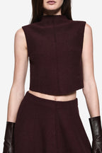 Burgundy boucle sleeveless high-neck crop top, close-up front panel