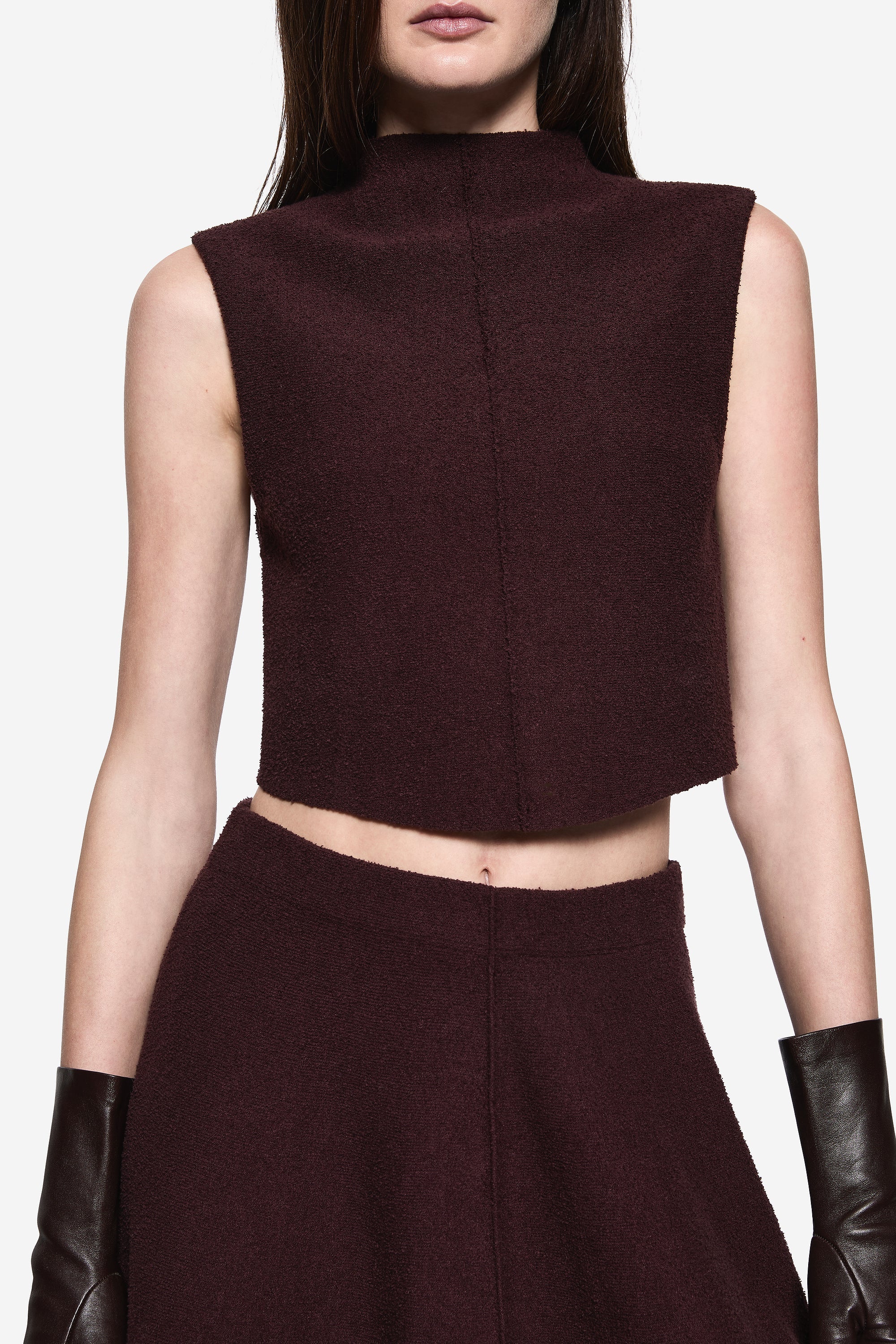Burgundy boucle sleeveless high-neck crop top, close-up front panel