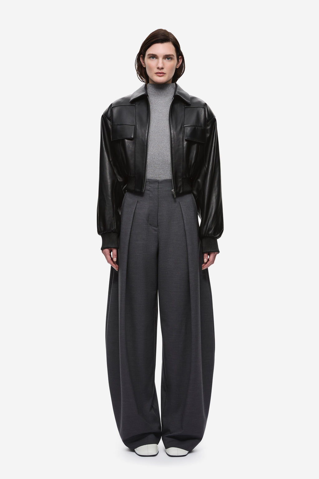 Black leather aviator jacket with zip front, snap collar, flap pockets