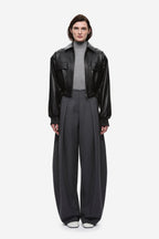 Black leather aviator jacket with zip front, snap collar, flap pockets