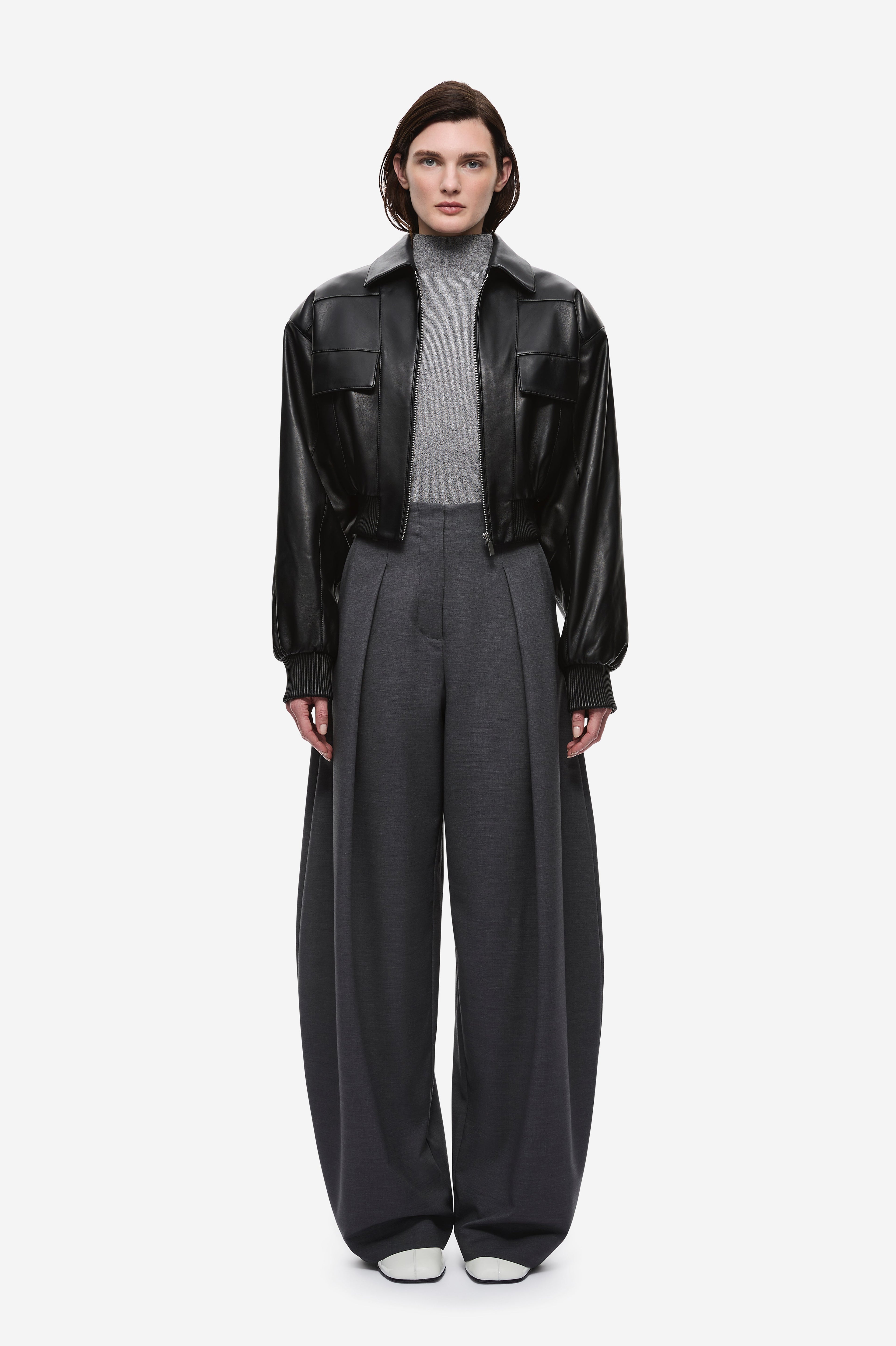 Black leather aviator jacket with zip front, snap collar, flap pockets