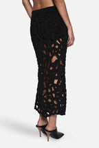 Black crochet midi skirt side detail with dense openwork lattice texture