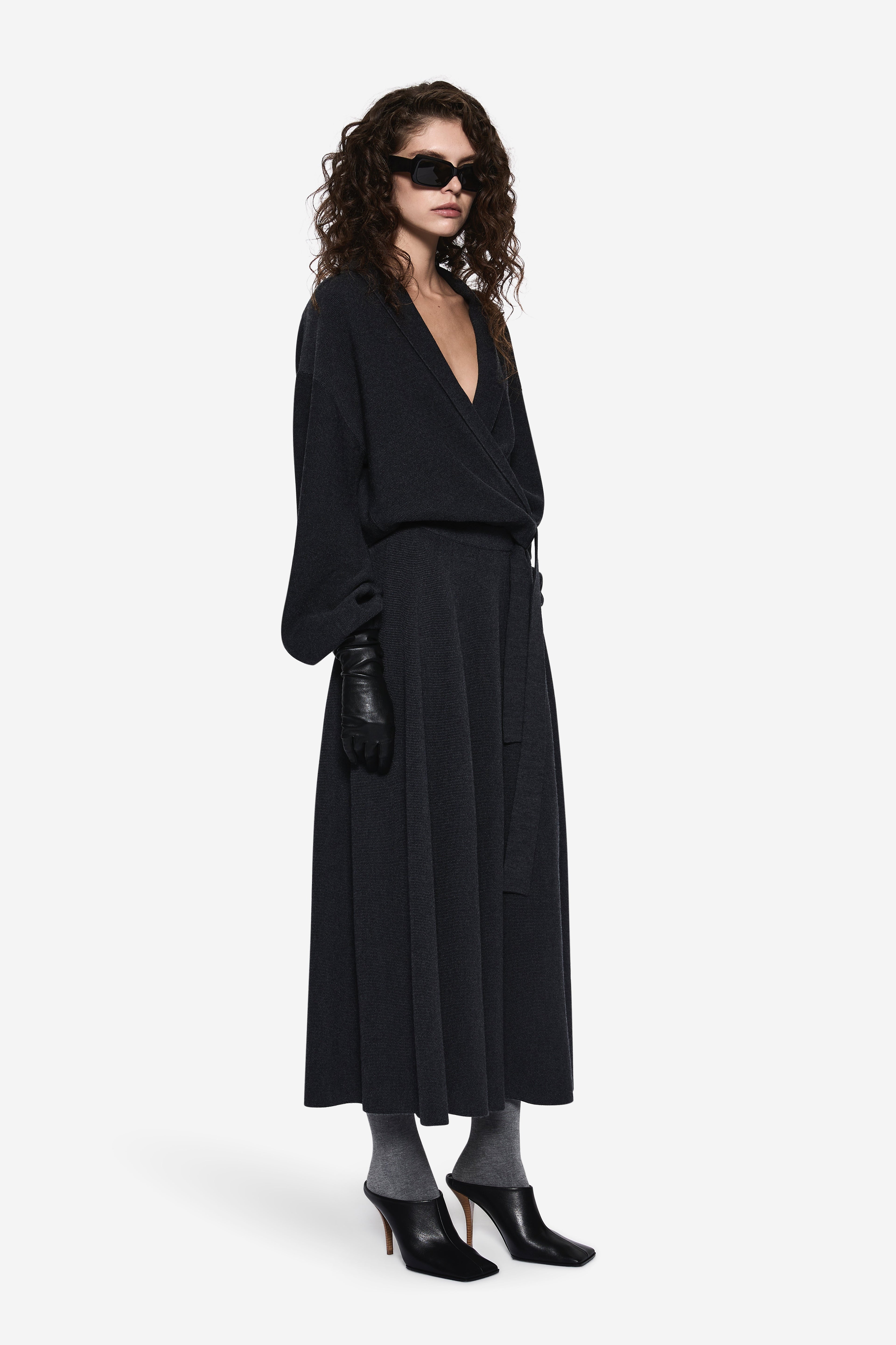 Dark charcoal merino A-line midi skirt, draped front, flared hem