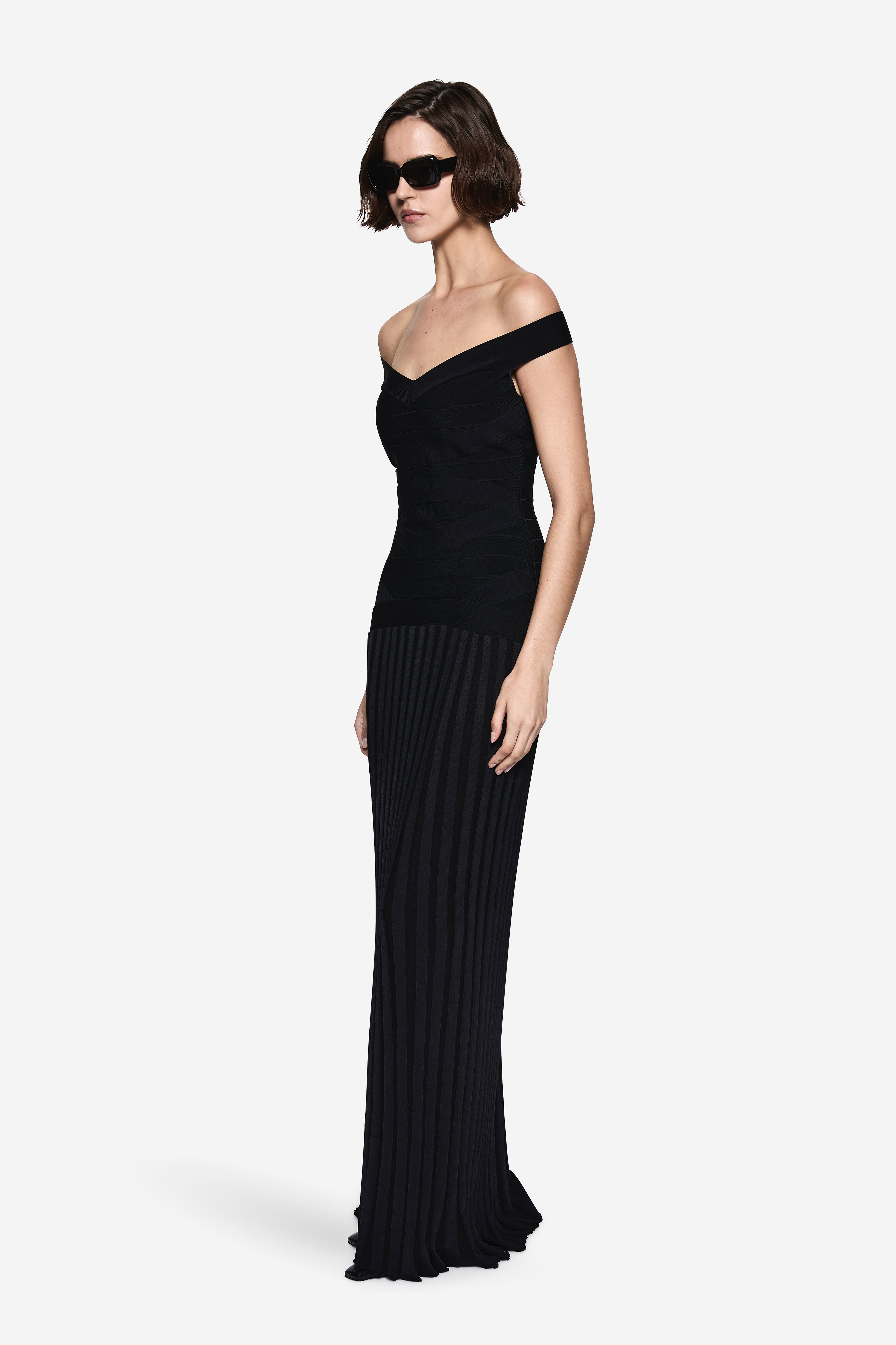 Black off-shoulder bandage knit dress, fitted waist, ribbed floor-length skirt