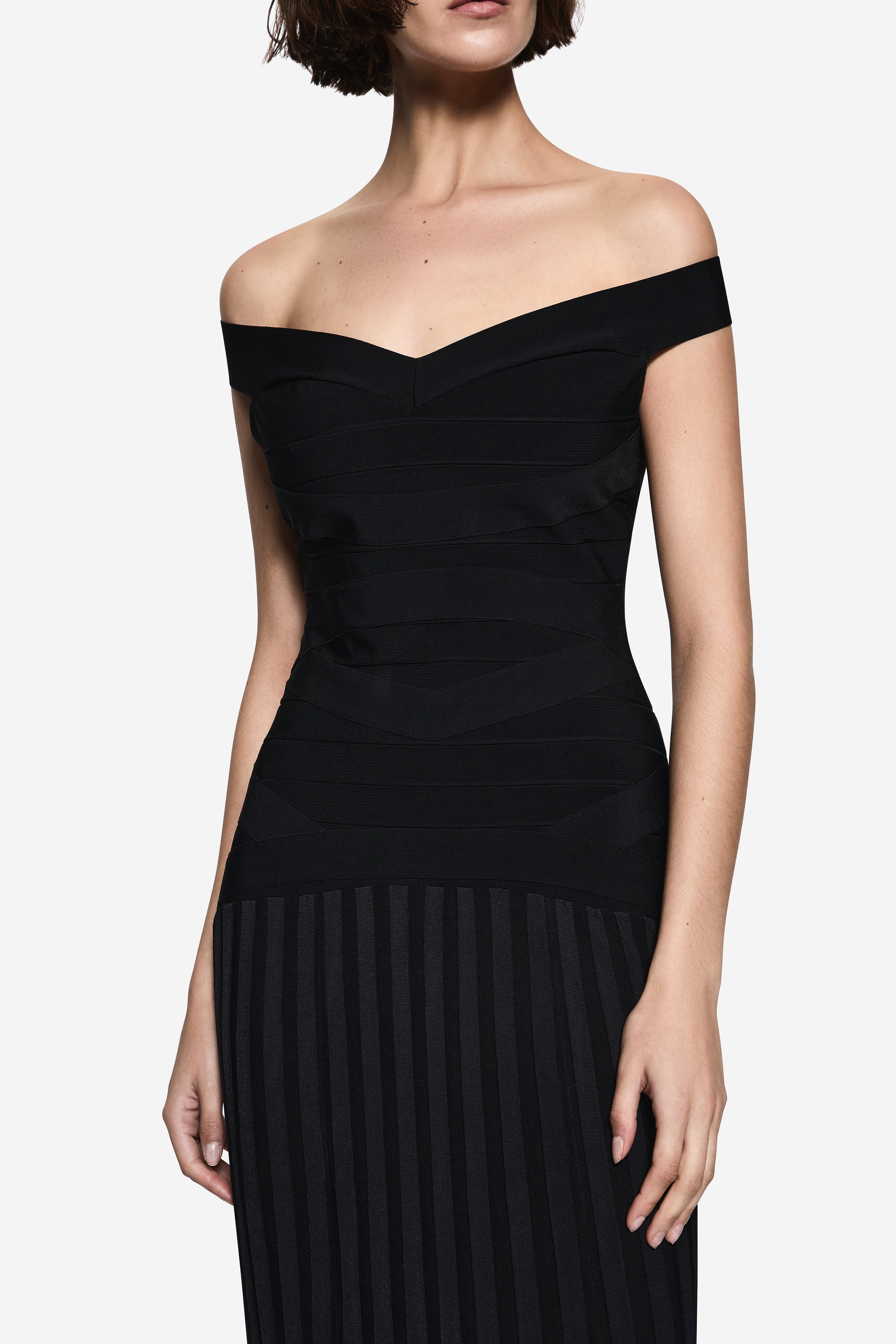 Black off-shoulder knit dress with diagonal bandage-look seams and ribbed skirt