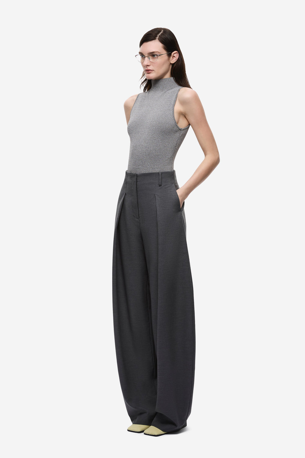 Dark grey wide-leg trousers with high waist, front pleats, and belt loops