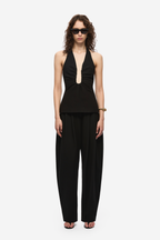 Black halter-neck top with deep keyhole cutout at the chest