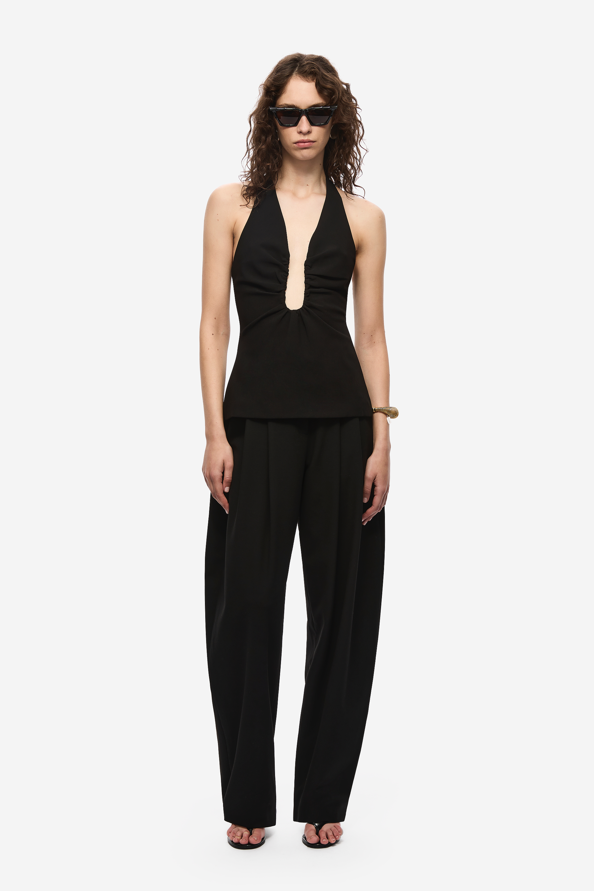 Black halter-neck top with keyhole neckline and slightly flared hem