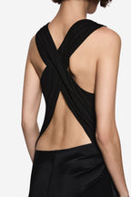 Black halter drape dress close-up with cross-back strap and open back