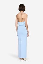 Pastel blue knit maxi dress from back, halter strap cross and low back