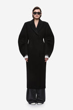 Black wool long coat with notched lapels and tailored single-breasted front.