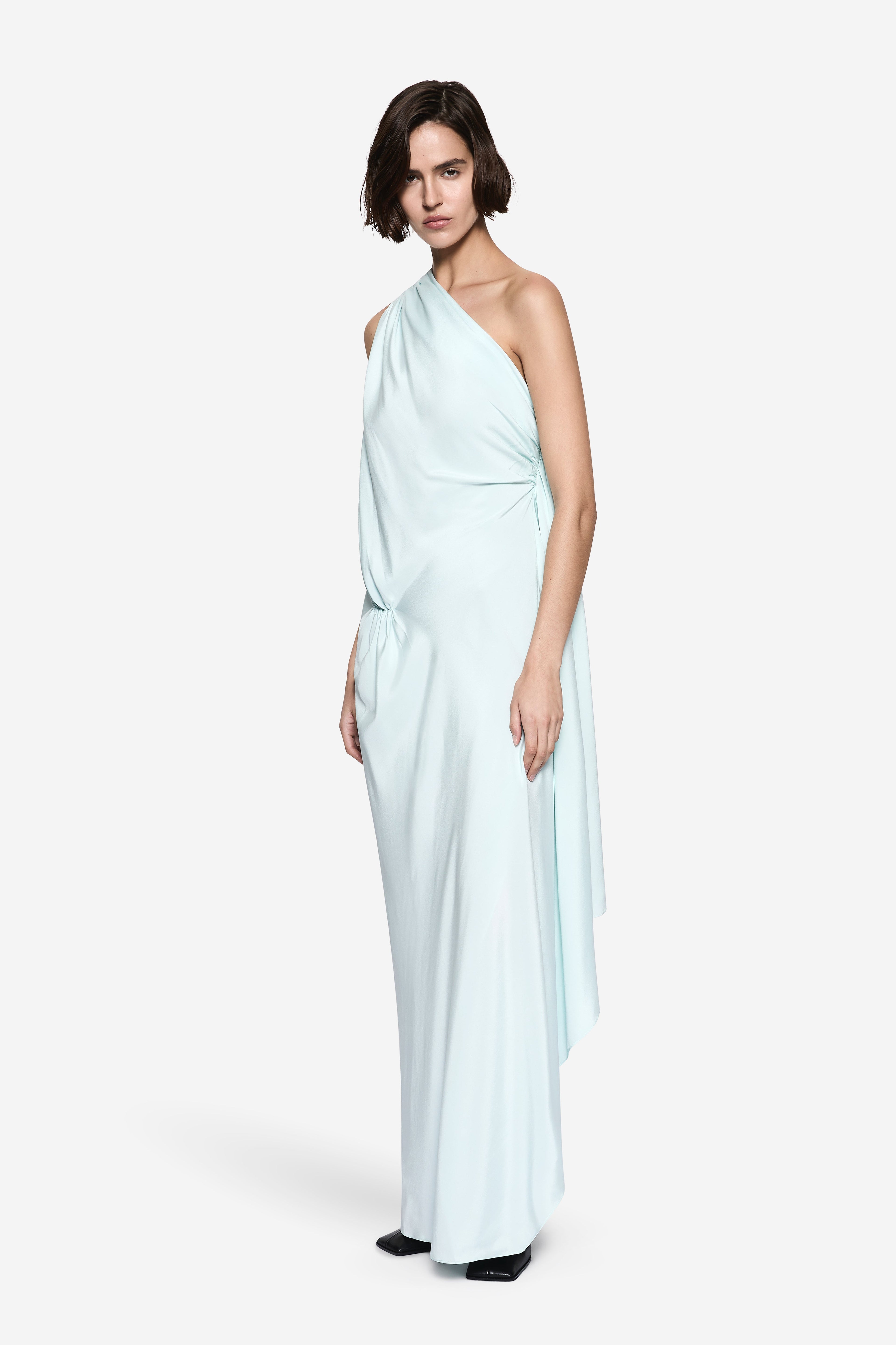 Aqua silk halter gown with draped side panel and long flowing skirt
