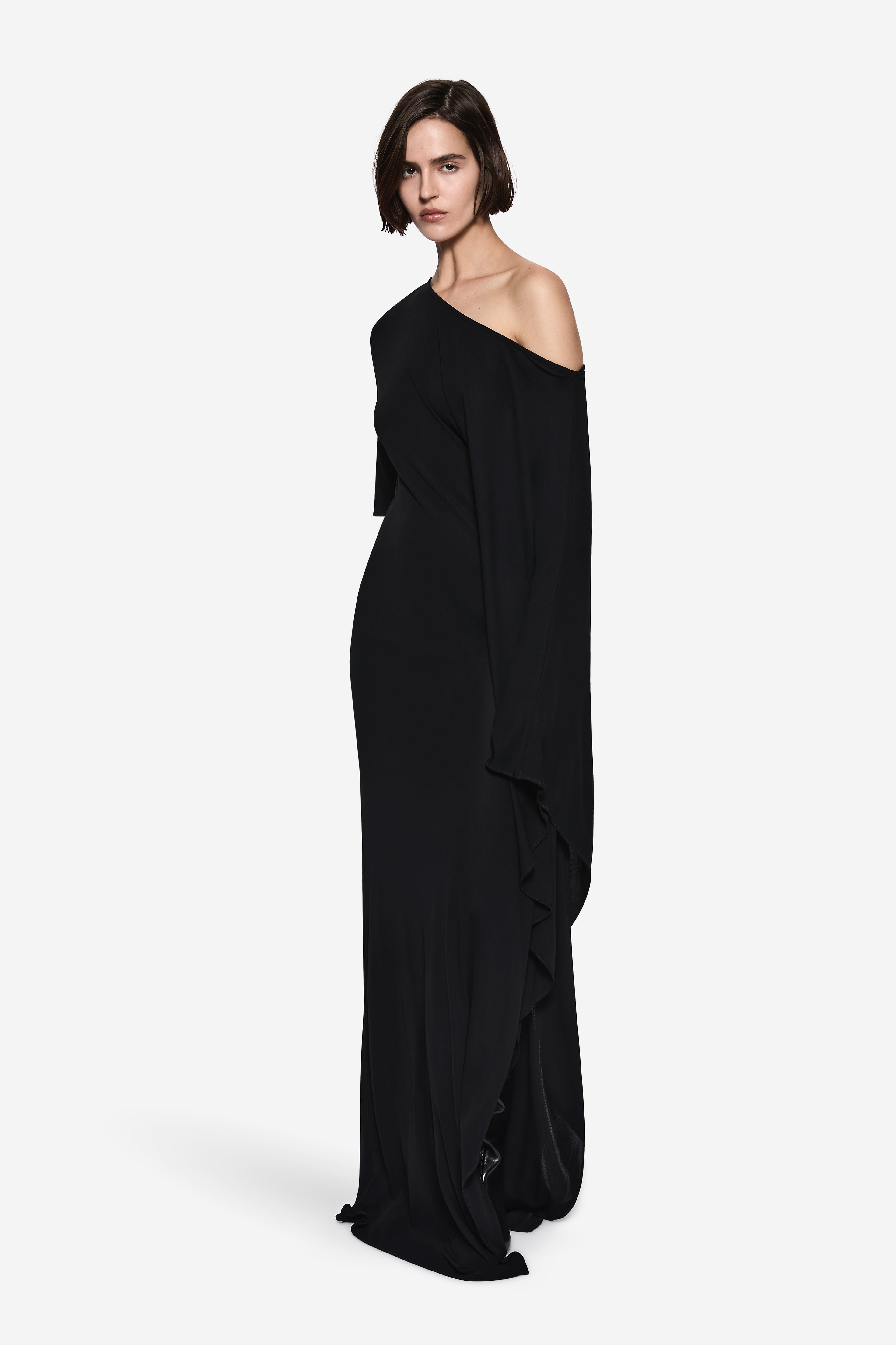 Black one-shoulder jersey maxi dress with draped side panel and long loose sleeves