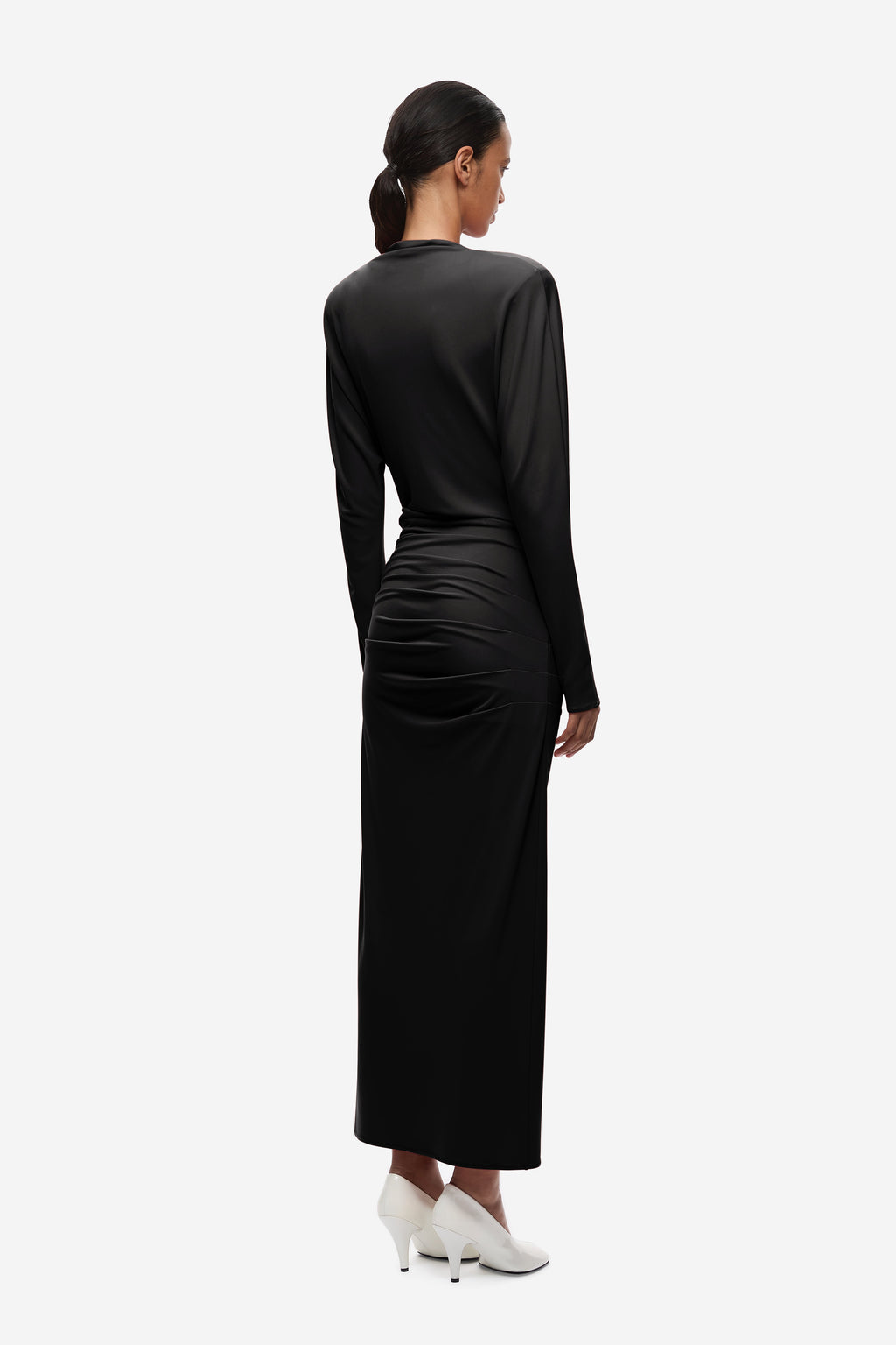 Black jersey draped midi dress, back view with ruched lower section
