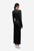 Black jersey draped midi dress, back view with ruched lower section