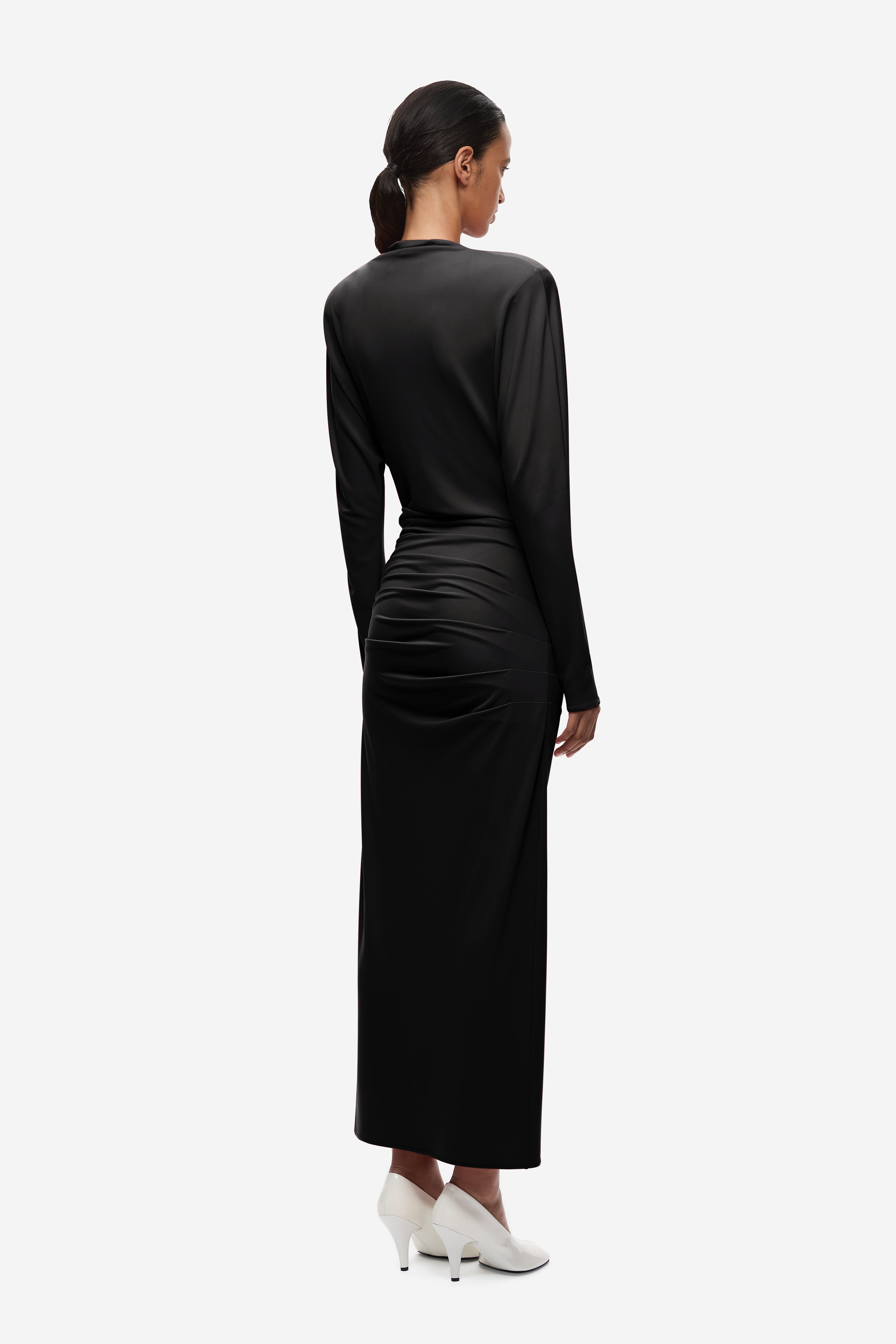 Black jersey draped midi dress, back view with ruched lower section