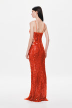 Red sequin maxi dress with strappy open-back detail, fitted column silhouette