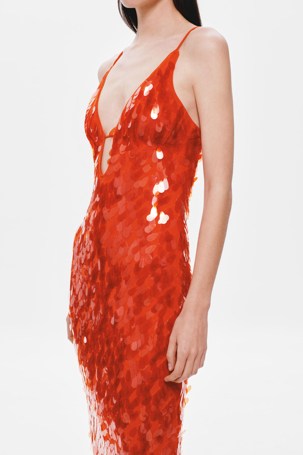 Red sequin maxi dress close-up with spaghetti straps and V-shaped neckline