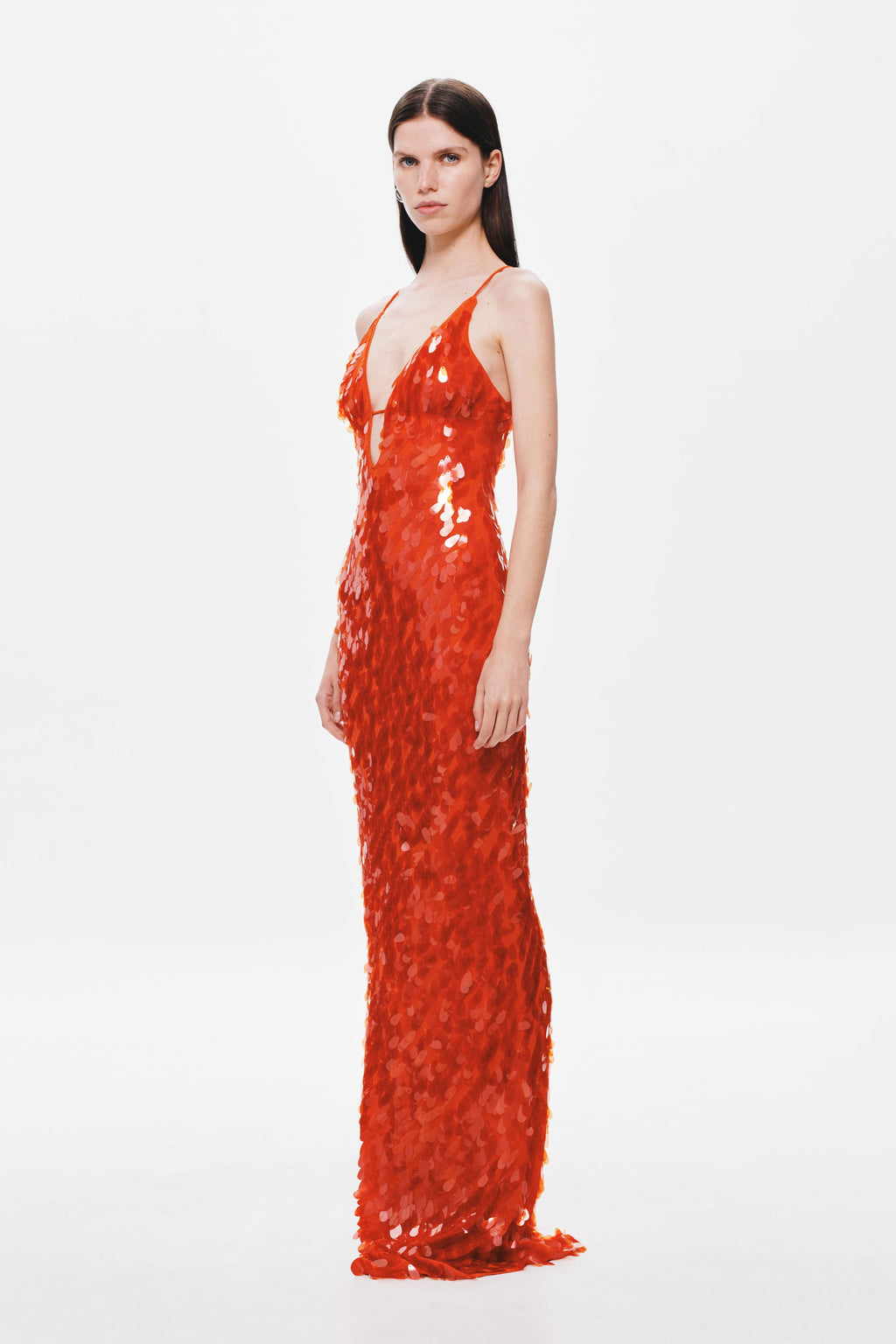 Red sequin maxi dress with spaghetti straps, fitted column silhouette, side view