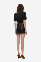 Black ruched leather mini skirt from back, smooth panel with subtle seam at waist