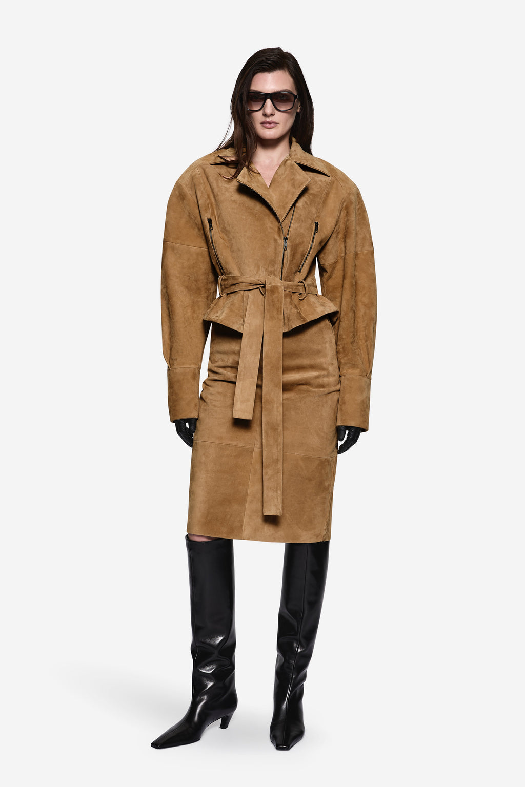 Suede leather skirt not visible; long suede coat covers lower body