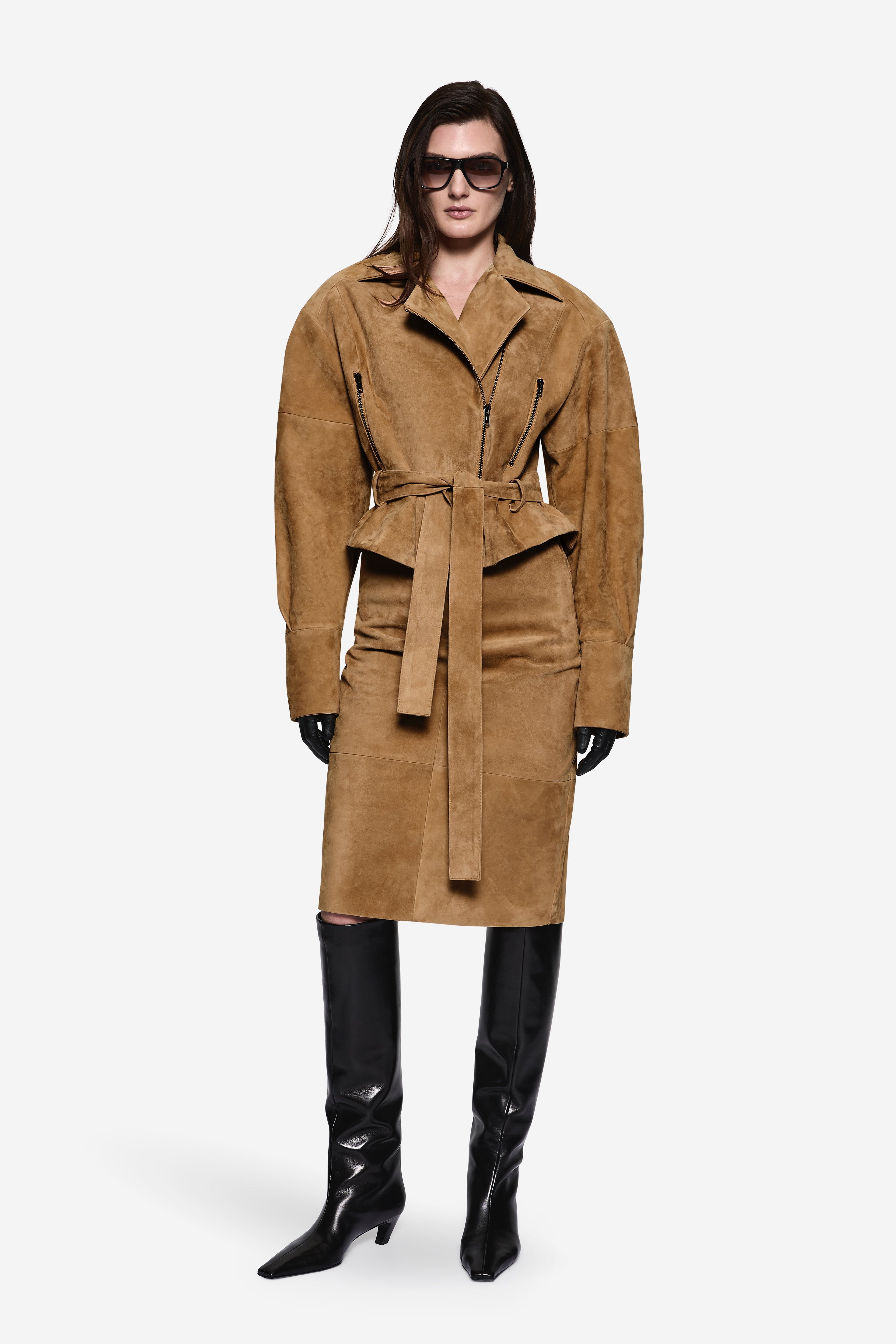 Suede leather skirt not visible; long suede coat covers lower body