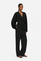 Black V-neck double-breasted blazer jacket with sculpted waist and long sleeves
