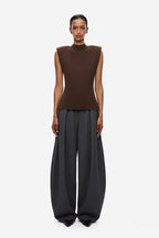 Chocolate sleeveless knit top with high neck and open back, fitted silhouette