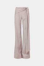 Stone suiting pants with wide legs and draped waist tie, front view.