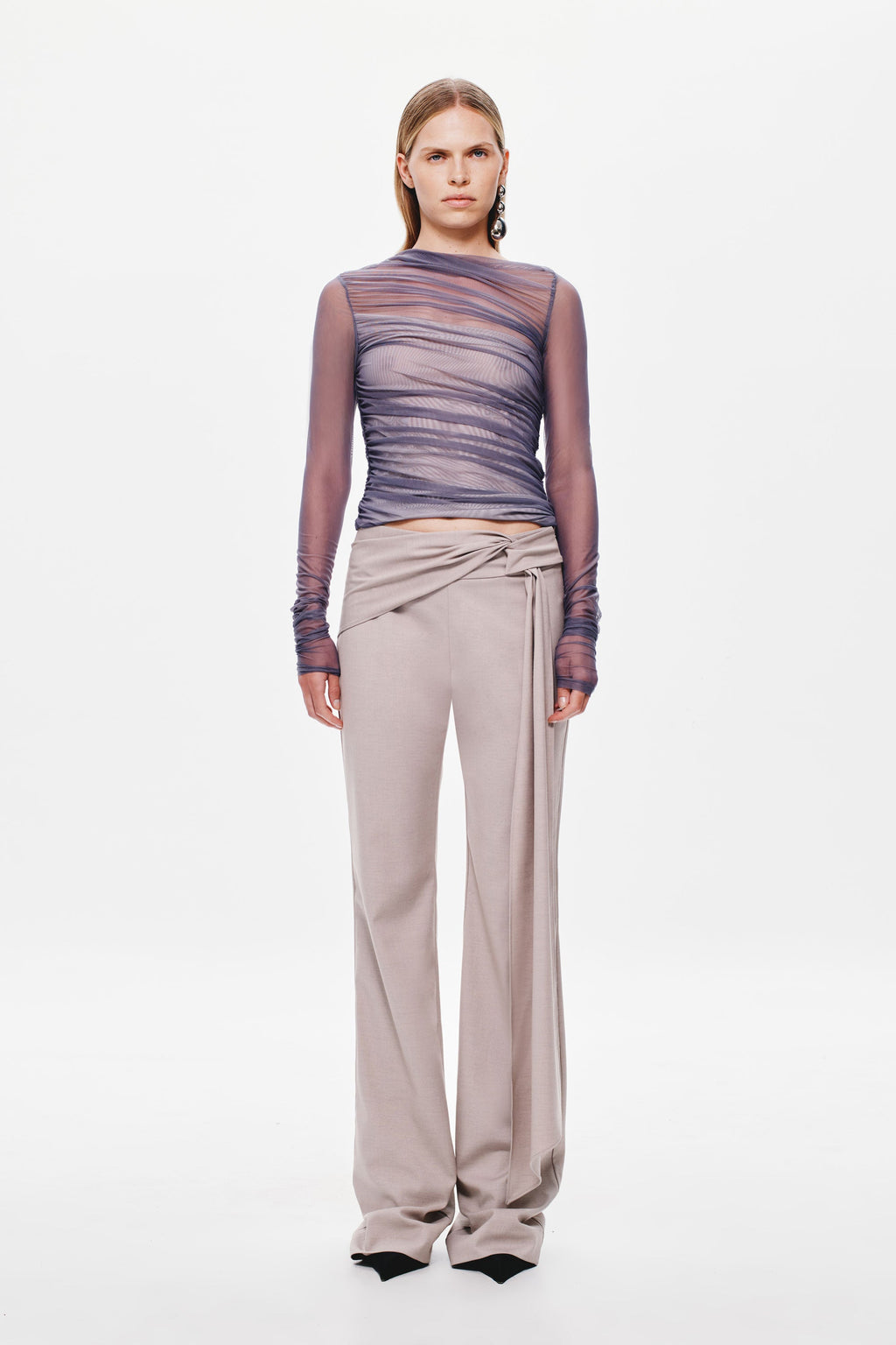 Stone wide-leg suiting pants with draped, knotted waist tie on model.