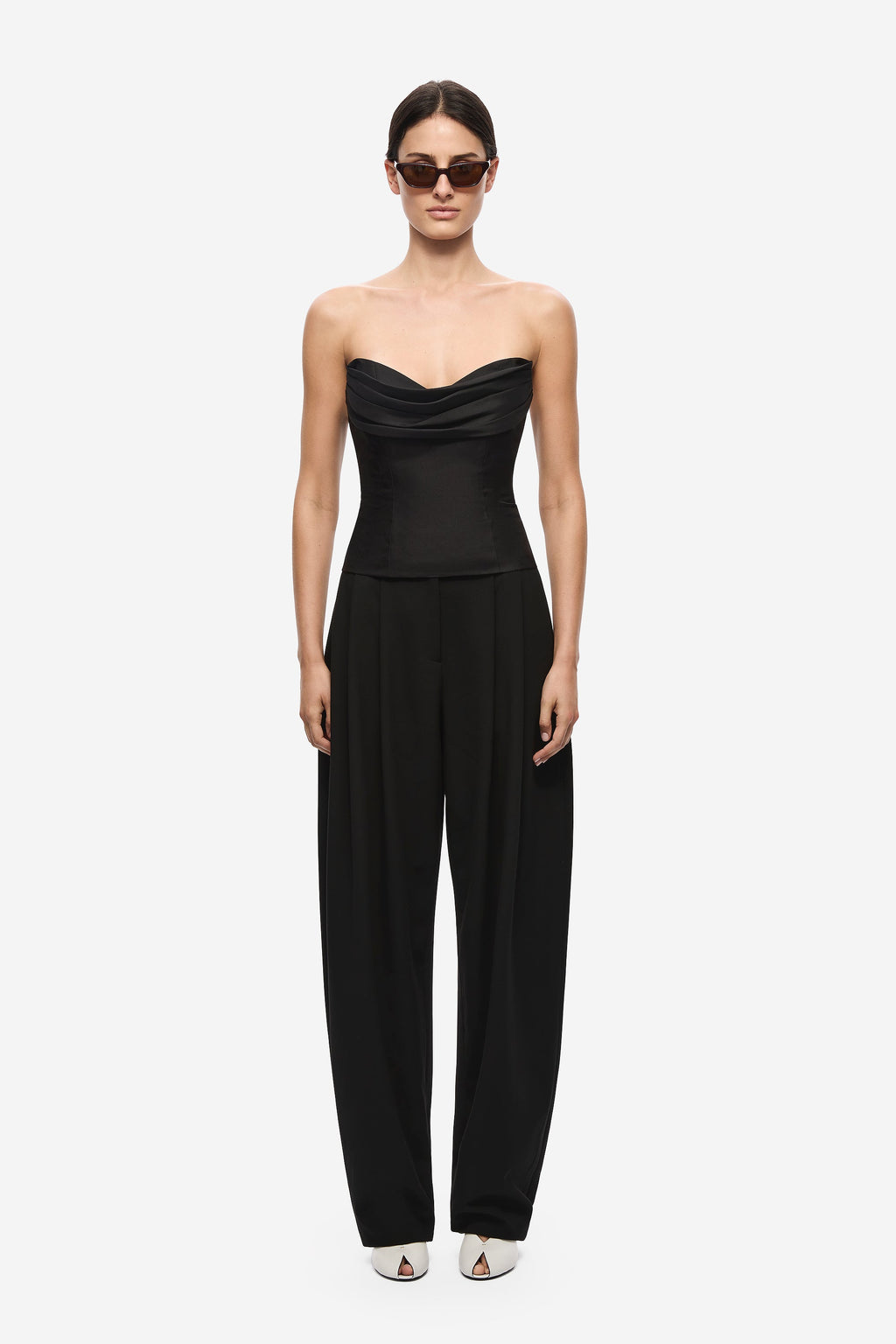 Black strapless silk bustier jumpsuit with wide-leg trousers and draped bust
