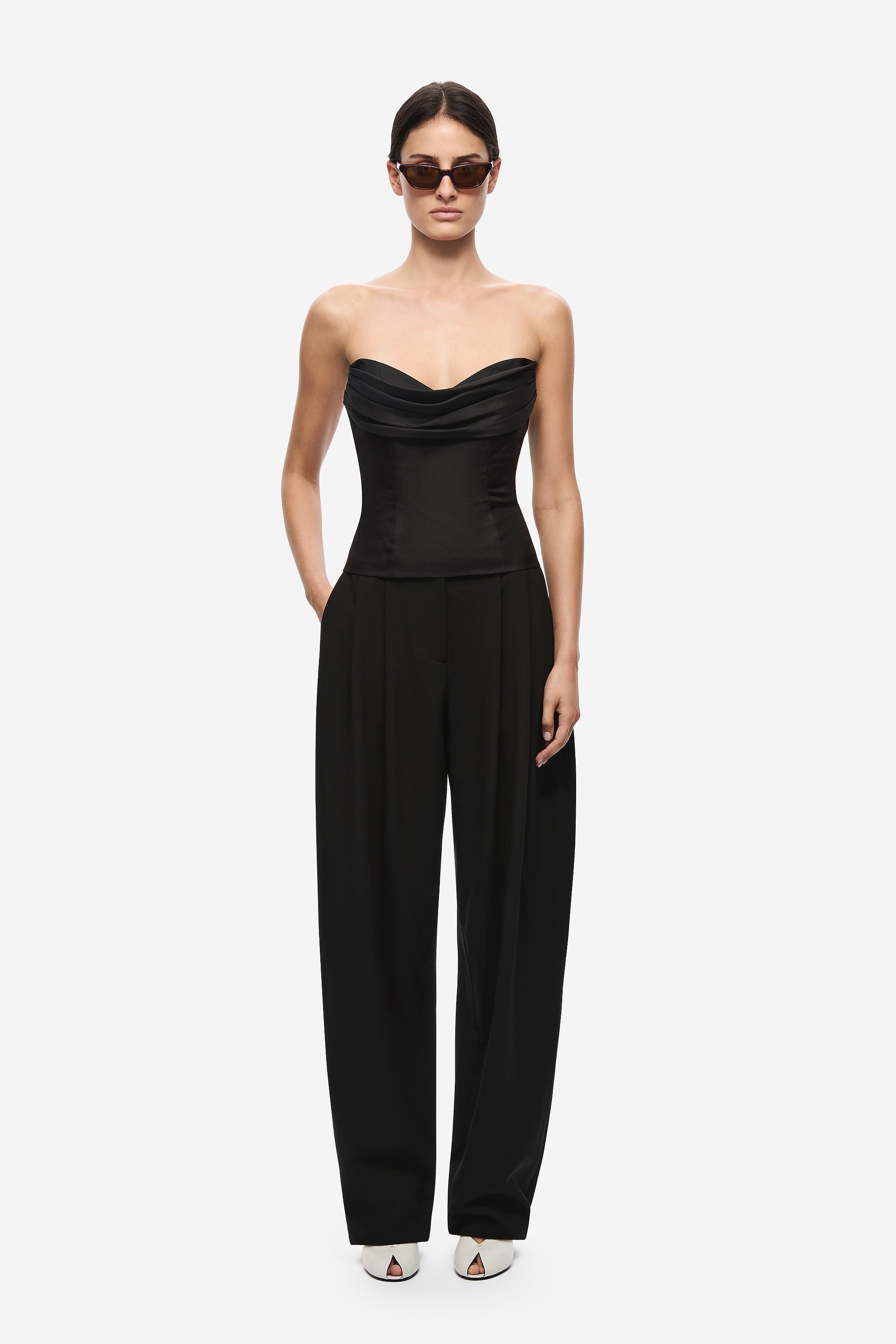 Black strapless silk bustier jumpsuit with draped sweetheart bodice and wide legs