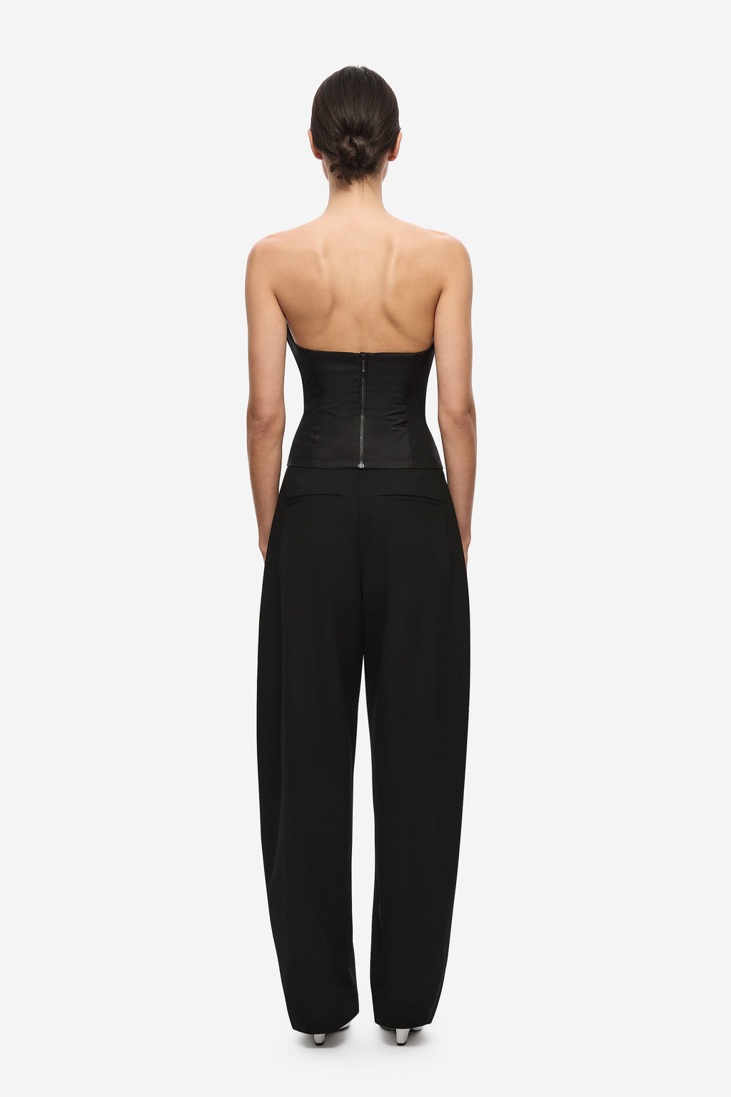 Black strapless silk bustier jumpsuit back view with center-back seam and zipper