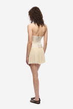 Pearled ivory silk bustier back view with vertical seaming and pleated hem