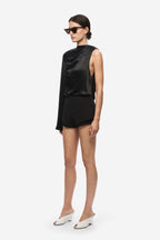 Black satin sleeveless top with high neck and draped front