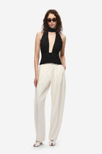 Black silk halter top with deep V cutout and draped neck tie