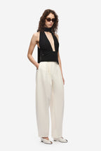 Black halter silk top with deep V neckline and open chest cutout